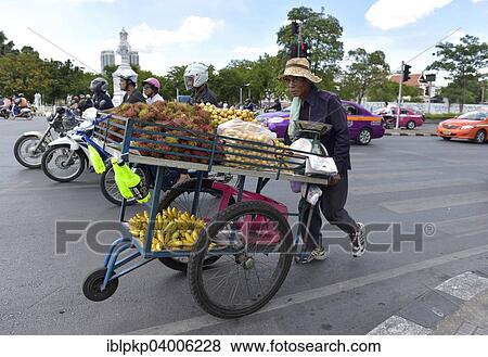 "Greengrocer pushing his cart along the street, Bangkok, Thailand, Asia" View Large Photo Image Stock Photo - "Greengrocer pushing his cart along the street, Bangkok, Thailand, Asia". Fotosearch