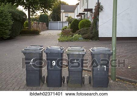 "Grey residual waste bins standing on the side of a road, Kamen, Ruhr area, North Rhine-Westphalia, Germany, Europe, PublicGround, Europe" View Large Photo Image Stock Image - "Grey residual waste bins standing on the side of a road, Kamen, Ruhr area, North Rhine-Westphalia, Germany, Europe, PublicGround, Europe". Fotosearch