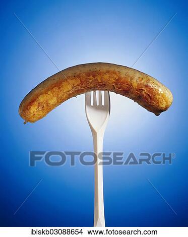 Grilled sausage on a plastic fork View Large Photo Image Picture - Grilled sausage on a plastic fork. Fotosearch