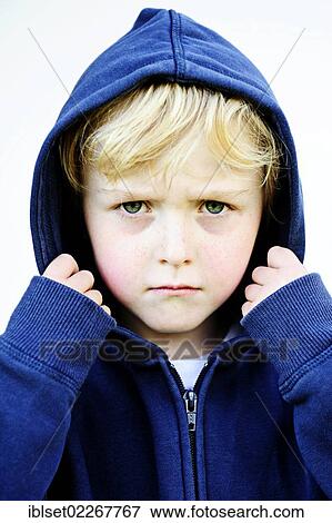 "Grim faced 5-year-old boy wearing a hoodie jacket, portrait" View Large Photo Image Stock Photo - "Grim faced 5-year-old boy wearing a hoodie jacket, portrait". Fotosearch
