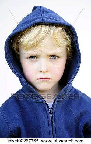 Stock Photography - "Grim faced 5-year-old boy wearing a hoodie jacket, portrait". Fotosearch