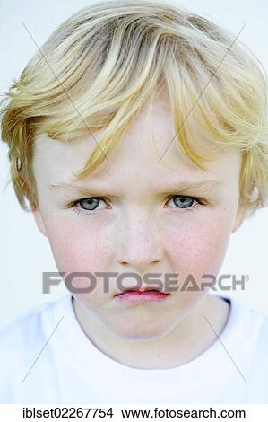 Grim faced little boy View Large Photo Image Picture - Grim faced little boy. Fotosearch