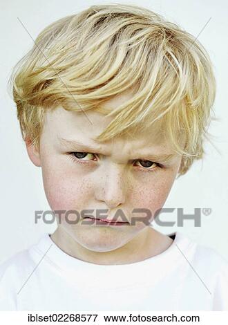 Grim faced little boy View Large Photo Image Stock Photo - Grim faced little boy. Fotosearch