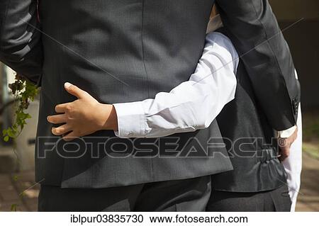 Stock Image - Groom and son waiting for the bride. Fotosearch