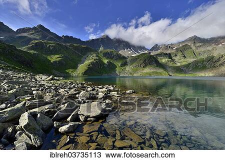 "Grosser Schwarzsee lake or Lago Nero, Schwarzwandspitz Mountain at the rear, Stubai Alps, Tyrol, Austria, Europe" View Large Photo Image Stock Image - "Grosser Schwarzsee lake or Lago Nero, Schwarzwandspitz Mountain at the rear, Stubai Alps, Tyrol, Austria, Europe". Fotosearch