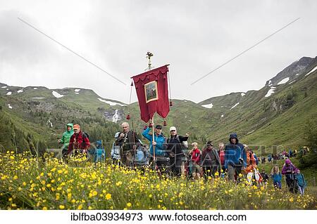 Stock Image - "Grossglockner pilgrimage from Fisch and Rauris, Salzburg State, to Heiligenblut, to St. Peter and Paul, here pilgrims on the way down to Heiligenblut, Carinthia, Austria, Europe". Fotosearch