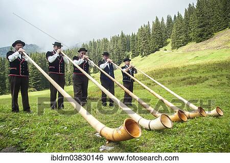 "Group of alphorn players performing on a meadow in Justistal valley, Beatenberg, Bernese Oberland, Switzerland, Europe" View Large Photo Image Stock Photograph - "Group of alphorn players performing on a meadow in Justistal valley, Beatenberg, Bernese Oberland, Switzerland, Europe". Fotosearch