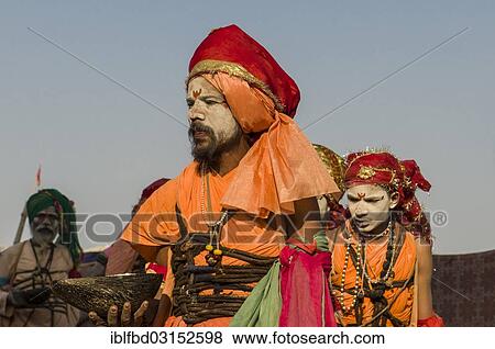 "Group of Gudar Sadhus, holy men, walking in a row and collecting offered food from fellow sadhus, at the Sangam, the confluence of the rivers Ganges, Yamuna and Saraswati, during Kumbha Mela festival, Allahabad, Uttar Pradesh, India, Asia" View Large Photo Image Stock Photo - "Group of Gudar Sadhus, holy men, walking in a row and collecting offered food from fellow sadhus, at the Sangam, the confluence of the rivers Ganges, Yamuna and Saraswati, during Kumbha Mela festival, Allahabad, Uttar Pradesh, India, Asia". Fotosearch