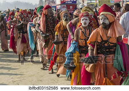 "Group of Gudar Sadhus, holy men, walking in a row and collecting offered food from fellow sadhus, at the Sangam, the confluence of the rivers Ganges, Yamuna and Saraswati, during Kumbha Mela festival, Allahabad, Uttar Pradesh, India, Asia" View Large Photo Image Stock Photography - "Group of Gudar Sadhus, holy men, walking in a row and collecting offered food from fellow sadhus, at the Sangam, the confluence of the rivers Ganges, Yamuna and Saraswati, during Kumbha Mela festival, Allahabad, Uttar Pradesh, India, Asia". Fotosearch