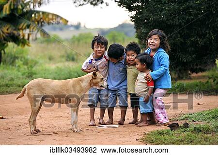 "Group of happy children with a dog, in a community of Guarani Indians, Jaguary, Caaguazu Department, Paraguay, South America" View Large Photo Image Stock Image - "Group of happy children with a dog, in a community of Guarani Indians, Jaguary, Caaguazu Department, Paraguay, South America". Fotosearch