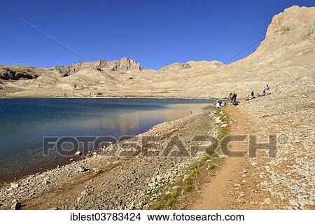 Picture - "Group of hikers at Hastakoca Lake, Yedigoller Plateau, Aladaglar National Park, High or Anti-Taurus Mountains, Turkey, Asia". Fotosearch
