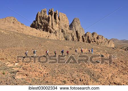 "Group of hikers at the diatreme, volcanic pipe, of Aouknet mountain, Hoggar Mountains, Atakor, Tamanrasset Province, Algeria, Africa" View Large Photo Image Picture - "Group of hikers at the diatreme, volcanic pipe, of Aouknet mountain, Hoggar Mountains, Atakor, Tamanrasset Province, Algeria, Africa". Fotosearch