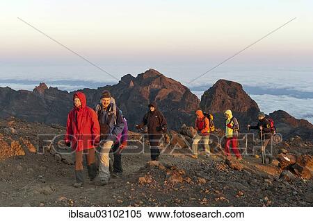 "Group of hikers on a hiking trail just before the summit of Piton des Neiges Mountain, 3070 m, near Cilaos, La Reunion, Reunion, France, Africa" View Large Photo Image Stock Photography - "Group of hikers on a hiking trail just before the summit of Piton des Neiges Mountain, 3070 m, near Cilaos, La Reunion, Reunion, France, Africa". Fotosearch