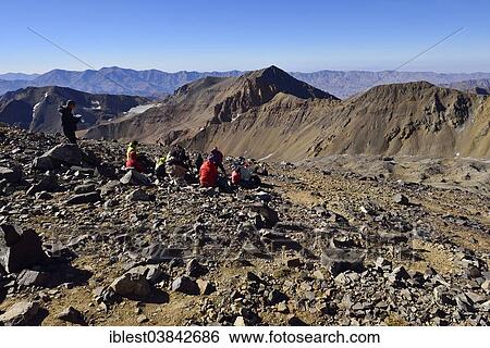 "Group of hikers resting on the way to Alam Kuh, 4848m, Kelardasht, Takht-e Suleyman Massif, Alborz Mountains, Mazandaran Province, Persia, Iran, Asia" View Large Photo Image Stock Photograph - "Group of hikers resting on the way to Alam Kuh, 4848m, Kelardasht, Takht-e Suleyman Massif, Alborz Mountains, Mazandaran Province, Persia, Iran, Asia". Fotosearch