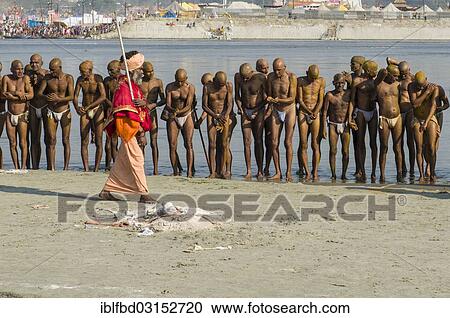 "Group of men standing in the river Ganges, getting orders by a guru as part of the initiation of new sadhus, during Kumbha Mela festival, Allahabad, Uttar Pradesh, India, Asia" View Large Photo Image Stock Image - "Group of men standing in the river Ganges, getting orders by a guru as part of the initiation of new sadhus, during Kumbha Mela festival, Allahabad, Uttar Pradesh, India, Asia". Fotosearch