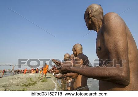 "Group of men standing in the river Ganges, getting orders by gurus as part of the initiation of new sadhus, during Kumbha Mela festival, Allahabad, Uttar Pradesh, India, Asia" View Large Photo Image Stock Photo - "Group of men standing in the river Ganges, getting orders by gurus as part of the initiation of new sadhus, during Kumbha Mela festival, Allahabad, Uttar Pradesh, India, Asia". Fotosearch