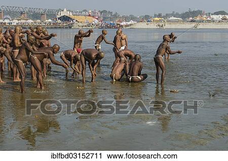 "Group of new sadhus praying in the river Ganges as part of their initiation, during Kumbha Mela festival, Allahabad, Uttar Pradesh, India, Asia" View Large Photo Image Stock Image - "Group of new sadhus praying in the river Ganges as part of their initiation, during Kumbha Mela festival, Allahabad, Uttar Pradesh, India, Asia". Fotosearch