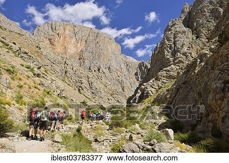 Stock Photo - "Group of people hiking in Cimbar Canyon, Aladaglar National Park, High or Anti-Taurus Mountains, Turkey, Asia". Fotosearch