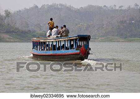 "Group of people on the roof of a ferry boat, Kaptai Lake, Rangamati, Chittagong Hill Tracts, Bangladesh, South Asia, Asia" View Large Photo Image Stock Photography - "Group of people on the roof of a ferry boat, Kaptai Lake, Rangamati, Chittagong Hill Tracts, Bangladesh, South Asia, Asia". Fotosearch