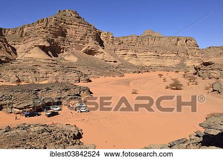 "Group of tourists resting at Tiseteka Canyon, Tadrart region, Tassili n’Ajjer National Park, Unesco World Heritage Site, Algeria, Sahara, North Africa, Africa" View Large Photo Image Picture - "Group of tourists resting at Tiseteka Canyon, Tadrart region, Tassili n’Ajjer National Park, Unesco World Heritage Site, Algeria, Sahara, North Africa, Africa". Fotosearch