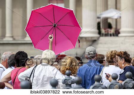 "Group of tourists with a tour guide holding a pink umbrella, Budapest, Hungary, Europe" View Large Photo Image Stock Image - "Group of tourists with a tour guide holding a pink umbrella, Budapest, Hungary, Europe". Fotosearch