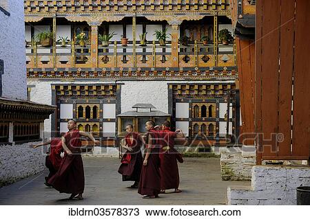 "Group of young monks practicing a religious dance in the courtyard of Mongar Dzong fortress, Mongar, Mongar District, Bhutan, Asia" View Large Photo Image Stock Image - "Group of young monks practicing a religious dance in the courtyard of Mongar Dzong fortress, Mongar, Mongar District, Bhutan, Asia". Fotosearch