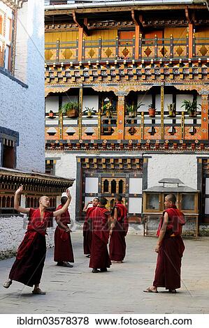 "Group of young monks practicing a religious dance in the courtyard of Mongar Dzong fortress, Mongar, Mongar District, Bhutan, Asia" View Large Photo Image Stock Photo - "Group of young monks practicing a religious dance in the courtyard of Mongar Dzong fortress, Mongar, Mongar District, Bhutan, Asia". Fotosearch