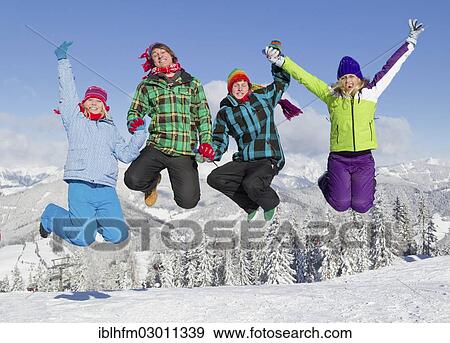 "Group of young people jumping on a ski slope, Salzburger Land, Flachau, Tyrol, Austria, Europe" View Large Photo Image Stock Photo - "Group of young people jumping on a ski slope, Salzburger Land, Flachau, Tyrol, Austria, Europe". Fotosearch