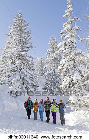 "Group of young people walking through a winter landscape, Salzburger Land, Flachau, Tyrol, Austria, Europe" View Large Photo Image Stock Image - "Group of young people walking through a winter landscape, Salzburger Land, Flachau, Tyrol, Austria, Europe". Fotosearch