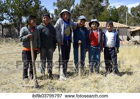 Stock Photo - "Group photo, boys with hoes, Union Potrero, Ayacucho, Peru, South America". Fotosearch
