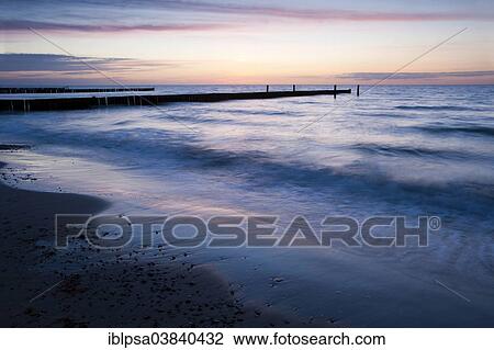 "Groyne at sunset on the coast at, Nienhagen, Mecklenburg-Western Pomerania, Germany, Europe" View Large Photo Image Stock Image - "Groyne at sunset on the coast at, Nienhagen, Mecklenburg-Western Pomerania, Germany, Europe". Fotosearch