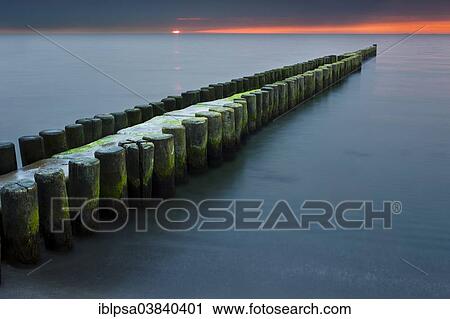 "Groynes on the Baltic coast at sunset, Mecklenburg-Western Pomerania, Zingst, Fischland-Darss-Zingst, Germany, Europe" View Large Photo Image Stock Image - "Groynes on the Baltic coast at sunset, Mecklenburg-Western Pomerania, Zingst, Fischland-Darss-Zingst, Germany, Europe". Fotosearch