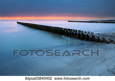 "Groynes on the Baltic coast, sunset, Mecklenburg-Western Pomerania, Zingst, Fischland-Darss-Zingst, Germany, Europe" View Large Photo Image Stock Image - "Groynes on the Baltic coast, sunset, Mecklenburg-Western Pomerania, Zingst, Fischland-Darss-Zingst, Germany, Europe". Fotosearch