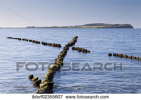 "Groynes on the beach, Hiddensee Island at back, Ruegen Island, Mecklenburg-Western Pomerania, Germany, Europe" View Large Photo Image Stock Photo - "Groynes on the beach, Hiddensee Island at back, Ruegen Island, Mecklenburg-Western Pomerania, Germany, Europe". Fotosearch
