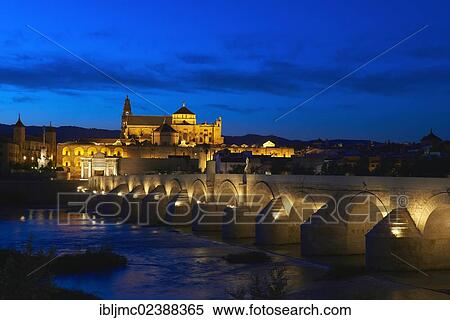 Stock Photography - "Guadalquivir river, Roman bridge and mosque-cathedral at dusk, Cordoba, Andalusia, Spain, Europe". Fotosearch