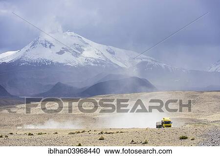 "Guallatiri volcano with a a truck en route to the Salar de Surire, Altiplano, Putre, Arica y Parinacota Region, Chile, South America" View Large Photo Image Stock Image - "Guallatiri volcano with a a truck en route to the Salar de Surire, Altiplano, Putre, Arica y Parinacota Region, Chile, South America". Fotosearch