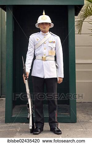 Stock Image - "Guardian at Chakri Maha Prasat, Grand Palace, Krung Thep, Bangkok, Thailand, Asia". Fotosearch