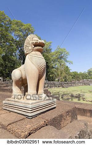Stock Image - "Guardian sculpture of a lion on the Terrace of the Elephants, Angkor Thom, Angkor, Siem Reap, Cambodia, Asia". Fotosearch