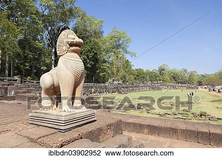 Stock Image - "Guardian sculpture of a lion on the Terrace of the Elephants, Angkor Thom, Angkor, Siem Reap, Cambodia, Asia". Fotosearch