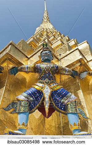 "Guardian statue at the base of a golden chedi, Wat Phra Kaeo or Wat Phra Kaew Temple, Royal Palace, Grosser Palast, Grand Palace, Bangkok, Central Thailand, Thailand, Asia" View Large Photo Image Stock Photo - "Guardian statue at the base of a golden chedi, Wat Phra Kaeo or Wat Phra Kaew Temple, Royal Palace, Grosser Palast, Grand Palace, Bangkok, Central Thailand, Thailand, Asia". Fotosearch