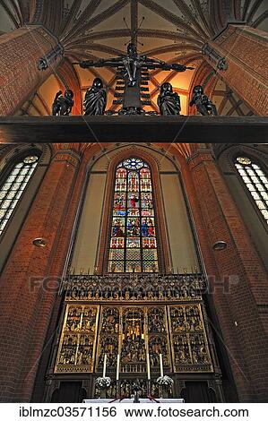 "Guestrow altar and stained glass window, above """"Triumphal Cross Group"""" of 1516, Marienkirche or St. Mary's Church, Gustrow, Mecklenburg-Western Pomerania, Germany, Europe" View Large Photo Image Stock Photograph - "Guestrow altar and stained glass window, above """"Triumphal Cross Group"""" of 1516, Marienkirche or St. Mary's Church, Gustrow, Mecklenburg-Western Pomerania, Germany, Europe". Fotosearch