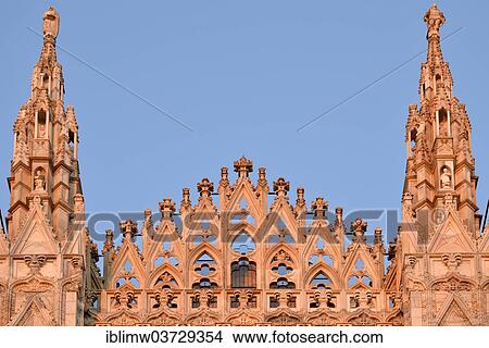 Picture - "Guglie, towers of the west facade of Milan Cathedral or Duomo di Santa Maria Nascente, in the evening light, Milan, Lombardy, Italy, Europe". Fotosearch