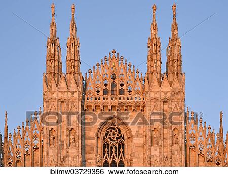 Stock Photograph - "Guglie, towers of the west facade of Milan Cathedral or Duomo di Santa Maria Nascente, in the evening light, Milan, Lombardy, Italy, Europe". Fotosearch