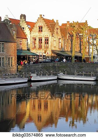 "Guild houses with stepped gables being reflected in a canal with boats, Bruges, West Flanders, Flemish Region, Belgium, Europe" View Large Photo Image Stock Photography - "Guild houses with stepped gables being reflected in a canal with boats, Bruges, West Flanders, Flemish Region, Belgium, Europe". Fotosearch