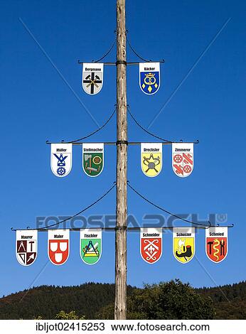 Guild pole with the emblems of all the trades of the town, Niedersorpe, Sauerland, North Rhine-Westphalia, Germany, Europe View Large Photo Image Stock Image - Guild pole with the emblems of all the trades of the town, Niedersorpe, Sauerland, North Rhine-Westphalia, Germany, Europe. Fotosearch