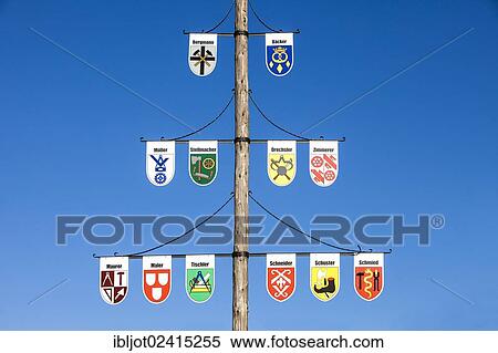 Guild pole with the emblems of all the trades of the town, Niedersorpe, Sauerland, North Rhine-Westphalia, Germany, Europe View Large Photo Image Stock Photography - Guild pole with the emblems of all the trades of the town, Niedersorpe, Sauerland, North Rhine-Westphalia, Germany, Europe. Fotosearch