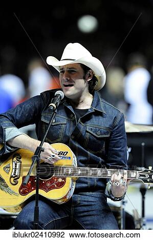 Stock Image - "Guitarist Hoss Power aka Sascha Vollmer of the The BossHoss band, performing at the qualifying match for the FIFA World Cup 2014, Germany - Sweden 4: 4, Olympic Stadium, Berlin, Germany, Europe". Fotosearch