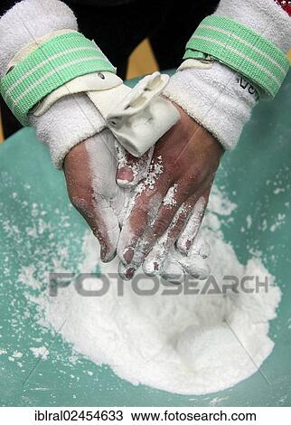 Gymnast rubbing chalk onto the palms of the hands View Large Photo Image Stock Image - Gymnast rubbing chalk onto the palms of the hands. Fotosearch