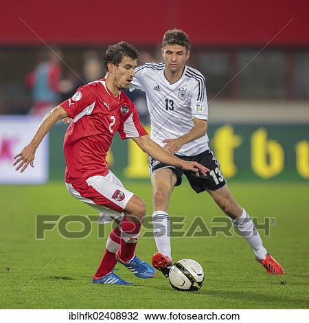 "Gyoergy Garics, #2 Austria, and Thomas Mueller, #13 Germany, fight for the ball during the WC qualifier soccer game on September 11, 2012 in Vienna, Austria, Europe" View Large Photo Image Stock Image - "Gyoergy Garics, #2 Austria, and Thomas Mueller, #13 Germany, fight for the ball during the WC qualifier soccer game on September 11, 2012 in Vienna, Austria, Europe". Fotosearch