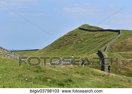 Stock Image - "Hadrian's Wall meandering through the landscape, Housesteads Roman Fort, Haydon Bridge, Hexham, Northumberland, England, United Kingdom, Europe". Fotosearch